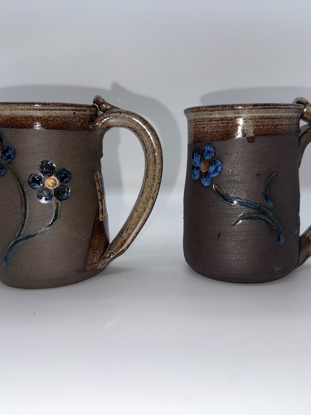 Handcrafted Brown Ceramic Mug with Blue Floral Detail